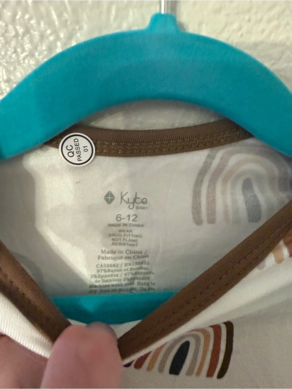 Kyte BABY Cream One-Piece with Brown Trim and Rainbow Print